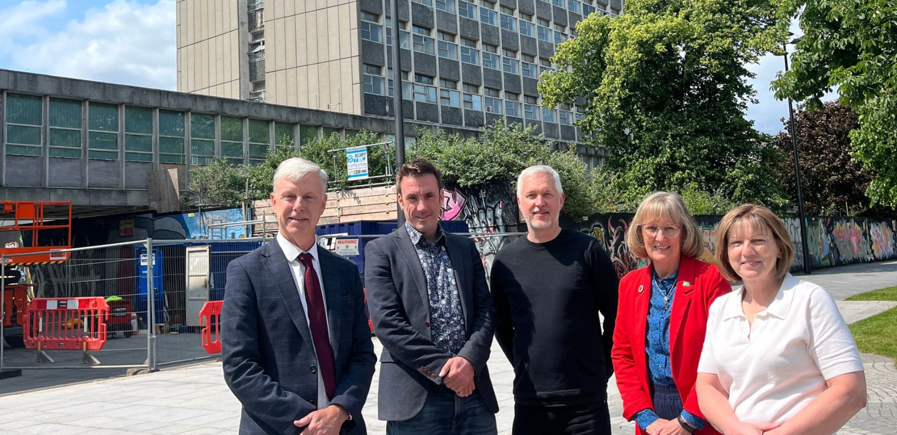 Four people stood in front of the Civic Centre