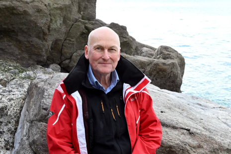 Richard Thompson sat on a rock 