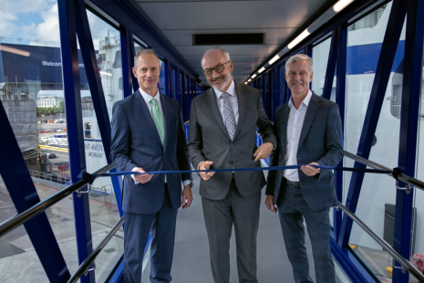 Three men stood on a tunnel to the port 